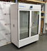 Left angled perspective view of a VWR double glass door chromatography refrigerator highlighting its left side panel, glass doors, and front caster assembly