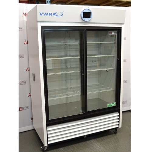 Left angled perspective view of a VWR HCCP-47-TS Performance Series chromatography refrigerator, showcasing its white exterior casing, dual sliding glass doors, internal wire shelving, and bottom louvered grill panel