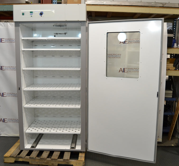 Front view of a VWR Model 1925 reach-in incubator with its door open, showcasing the interior white chamber, multiple slotted wire shelves, top-mounted control panel, and the inner side of the door with a viewing window