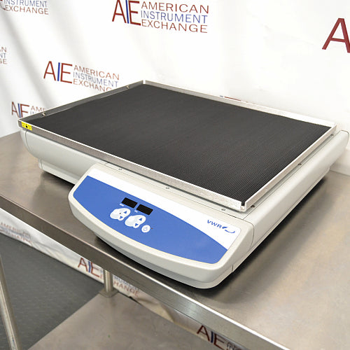 Right three-quarter angle product view of a VWR Model 5000 advanced orbital shaker, showcasing the non-slip platform mat, low-profile housing on a stainless steel table, and front-mounted digital control panel