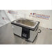 Right angled perspective view of VWR PolyScience WBE05 digital water bath with clear gabled lid on stainless steel table showing digital control display