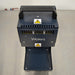 Overhead angle product view of a Waters Combi Thermo Sealer plate sealing machine, showcasing the top handle, safety warning labels, ventilation grille, and base platform on a lab bench