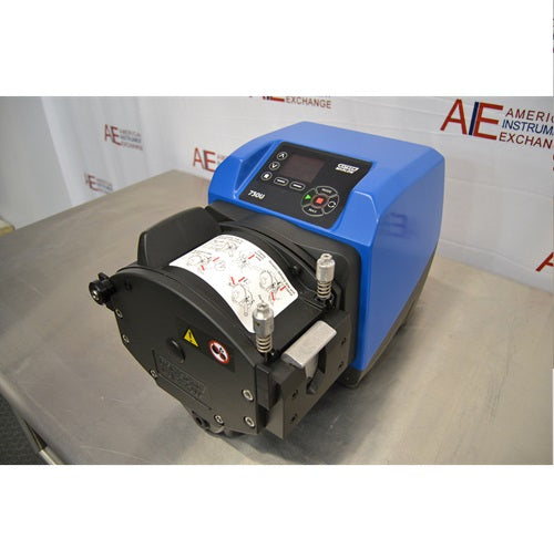 Angled perspective view of Watson Marlow 730UN peristaltic process pump displaying blue drive unit, control interface, and front peristaltic pump head assembly