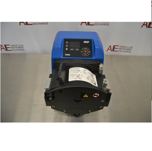 Front view of Watson Marlow 730UN peristaltic process pump displaying blue drive casing, top digital control keypad, and front-mounted black pump head