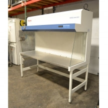 An alternative angled view of a Thermo Heraguard ECO 1.8 laminar flow clean bench, showing its wide stainless steel work surface, open front workspace, side glass panels, and upper control console.