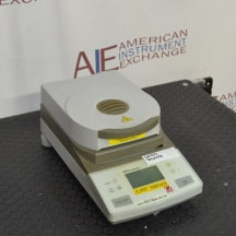 Angled front view of Ohaus MB35 moisture analyzer balance with heating cover closed