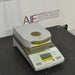 Angled front view of Ohaus MB35 moisture analyzer balance with heating cover closed
