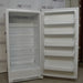 Angled view of open Fisher Scientific Isotemp Value laboratory refrigerator with internal shelving and door compartments