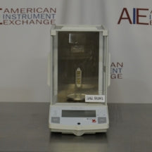 Direct front view of Ohaus Explorer E10640 analytical balance with glass draft shield enclosure