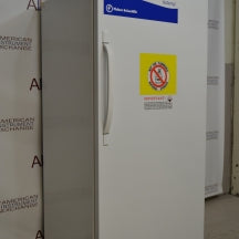 Left-side angled view of Fisher Scientific Isotemp Value laboratory refrigerator with door handle and warning label