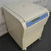Front angled perspective view of a Thermo Scientific Sorvall Legend XFR floor-standing refrigerated centrifuge on casters, featuring its beige housing, closed lid, louvered lower base, and front control panel