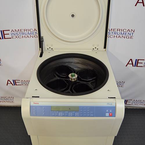 Front eye-level view of a Thermo Scientific Sorvall Legend XFR floor-standing refrigerated centrifuge with its top lid swung open, revealing the internal rotor chamber equipped with swing-out buckets and the front digital control panel