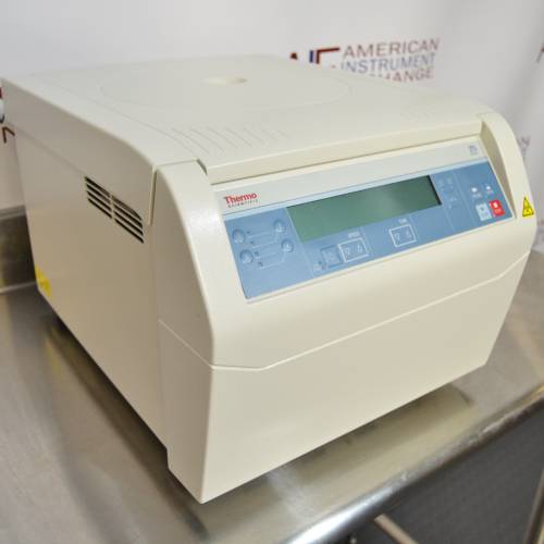Front angled perspective view of a Thermo Scientific Sorvall ST8 benchtop centrifuge resting on a stainless steel surface, highlighting its light grey housing, closed lid, side ventilation vents, and digital control panel