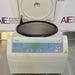 Front eye-level view of a Thermo Scientific Sorvall ST8 benchtop centrifuge with its top lid swung open, revealing the empty stainless steel interior rotor chamber and the front digital control panel